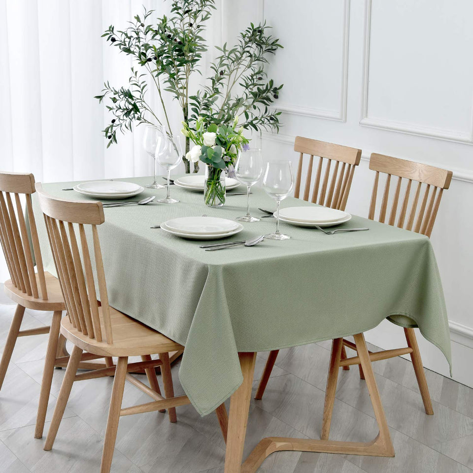 Maxmill rectangle textured tablecloth in sage green for elegant indoor dining.