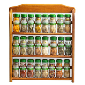 McCormick Gourmet three-tier wood spice rack on countertop keeps spices organized.
