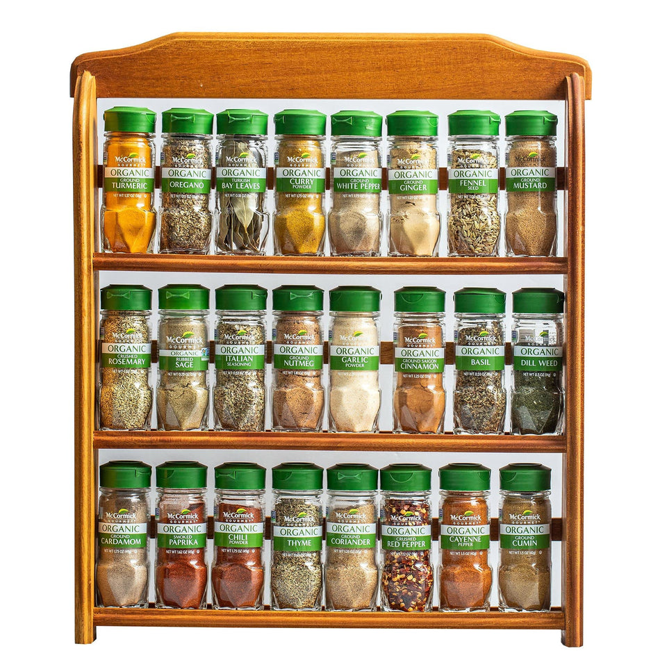 McCormick Gourmet three-tier wood spice rack on countertop keeps spices organized.