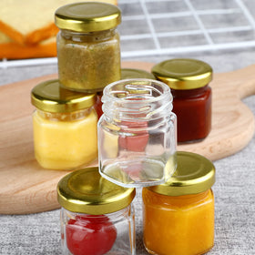 McUpper honey jar 1.5oz with gold lid for pouring.
