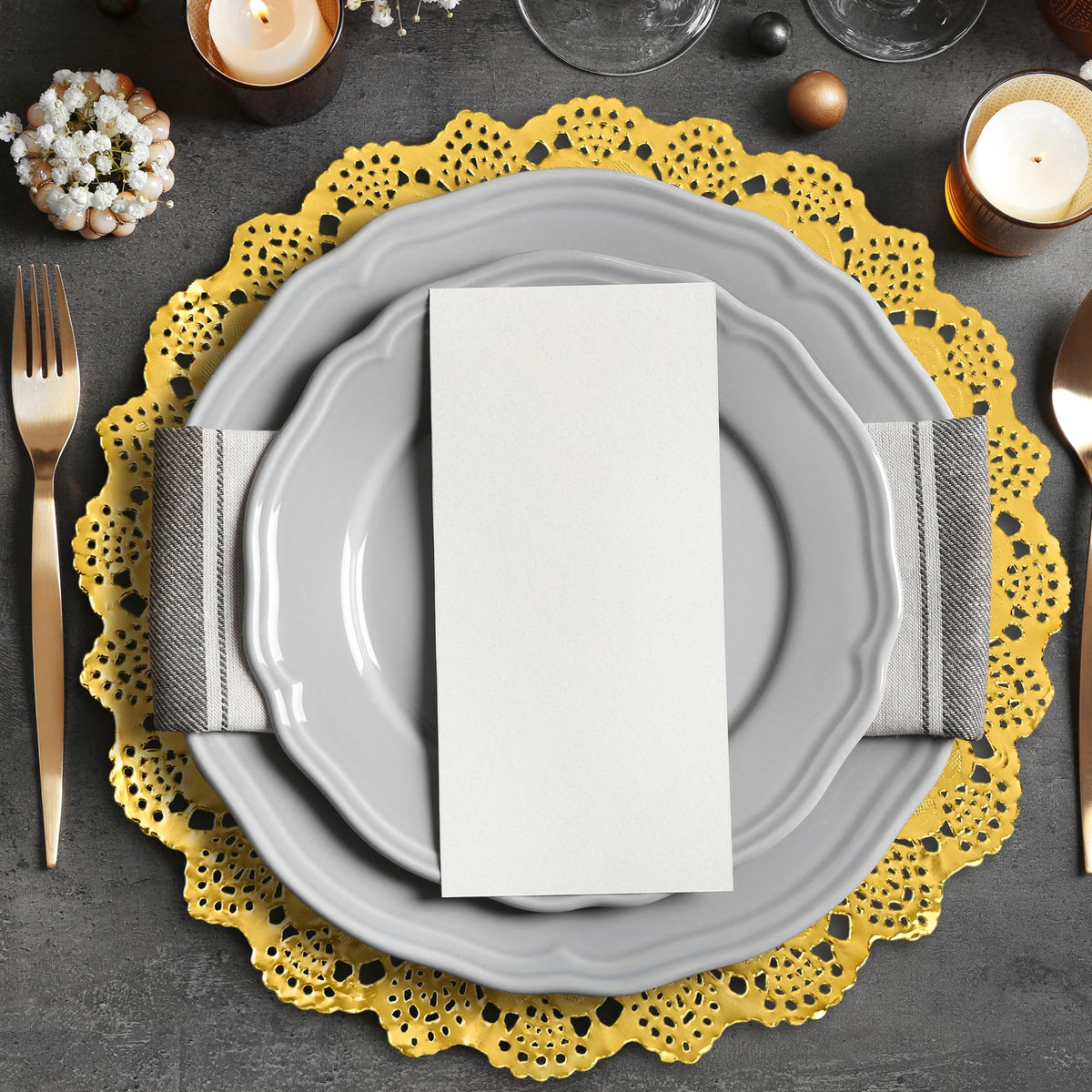 MCEAST dinner party setup using gold doilies for elegant tables.