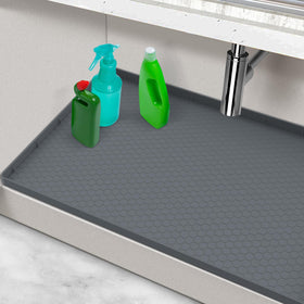 MECHEER waterproof under-sink mat, 28in x 19in, shields cabinets from leaks and spills.