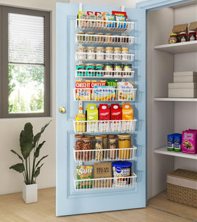Mefirt over-the-door pantry organizer with eight deep baskets for clutter-free storage.