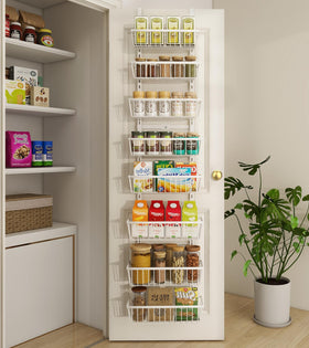 Mefirt pantry organizer on door saves space for kitchen essentials.
