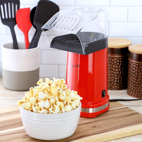 Megachef red popcorn popper on countertop adds vibrant style and practical performance.
