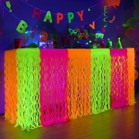 Mega-L Glow neon table skirt with fringe complements neon party table decor.