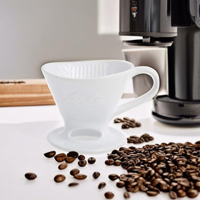 Melitta brewing steps illustration guiding controlled pour and consistent flavor.