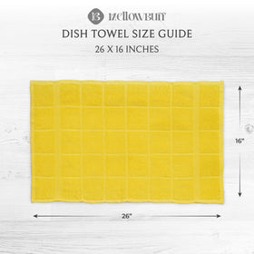 Mellow Buff folded yellow towels stacked neatly in kitchen