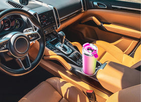 Meoky night mug resting in car cup holder with tapered bottom design.