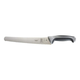 Mercer Culinary Millennia 10-inch bread knife with wavy edge in gray slicing through bread crusts clearly