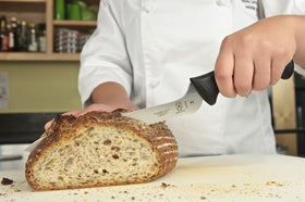 Millennia knife being hand-washed to demonstrate proper care