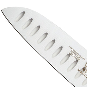 Mercer Genesis 7in Santoku balanced bolster supports controlled cutting.