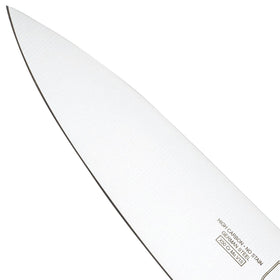 Mercer Genesis 8-Inch knife mincing garlic with steady control on a board.