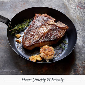 Merten & Storck oven and grill compatible carbon steel pan for versatile cooking.