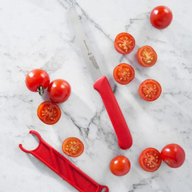 Messermeister tomato knife with sheath stored neatly in kitchen drawer.