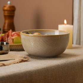 Metflavor Sculpted Dune glaze finish cleans easily, dishwasher friendly after family meals.