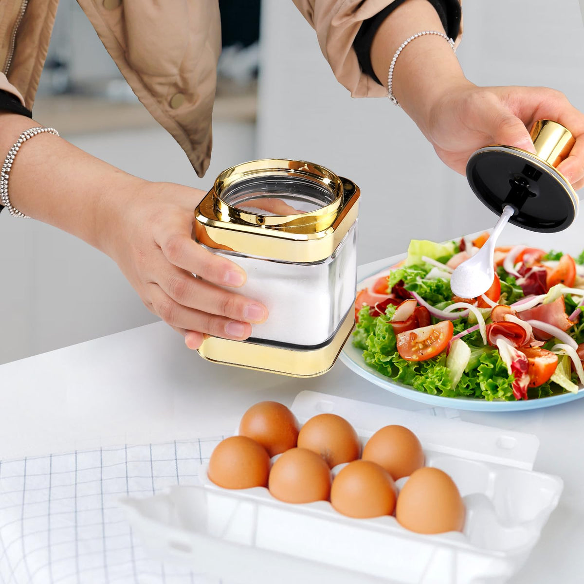 Mezchi gold finish on lids adds a refined touch to kitchen tables and counters.