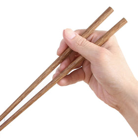 Close-up of golden-dark wood grain on M.G chopsticks, durable and splinter-free