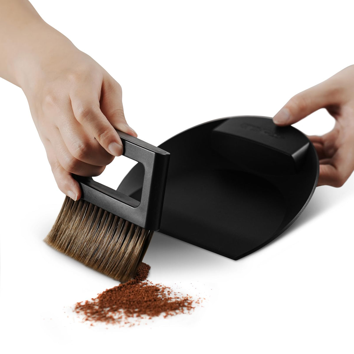 MHW-3BOMBER small coffee brush and dustpan set displayed on counter for quick cleanup.
