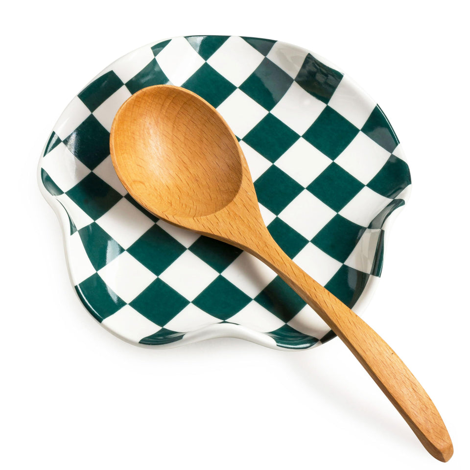 Miamolo ceramic spoon rest on stove top catching drips for a clean surface