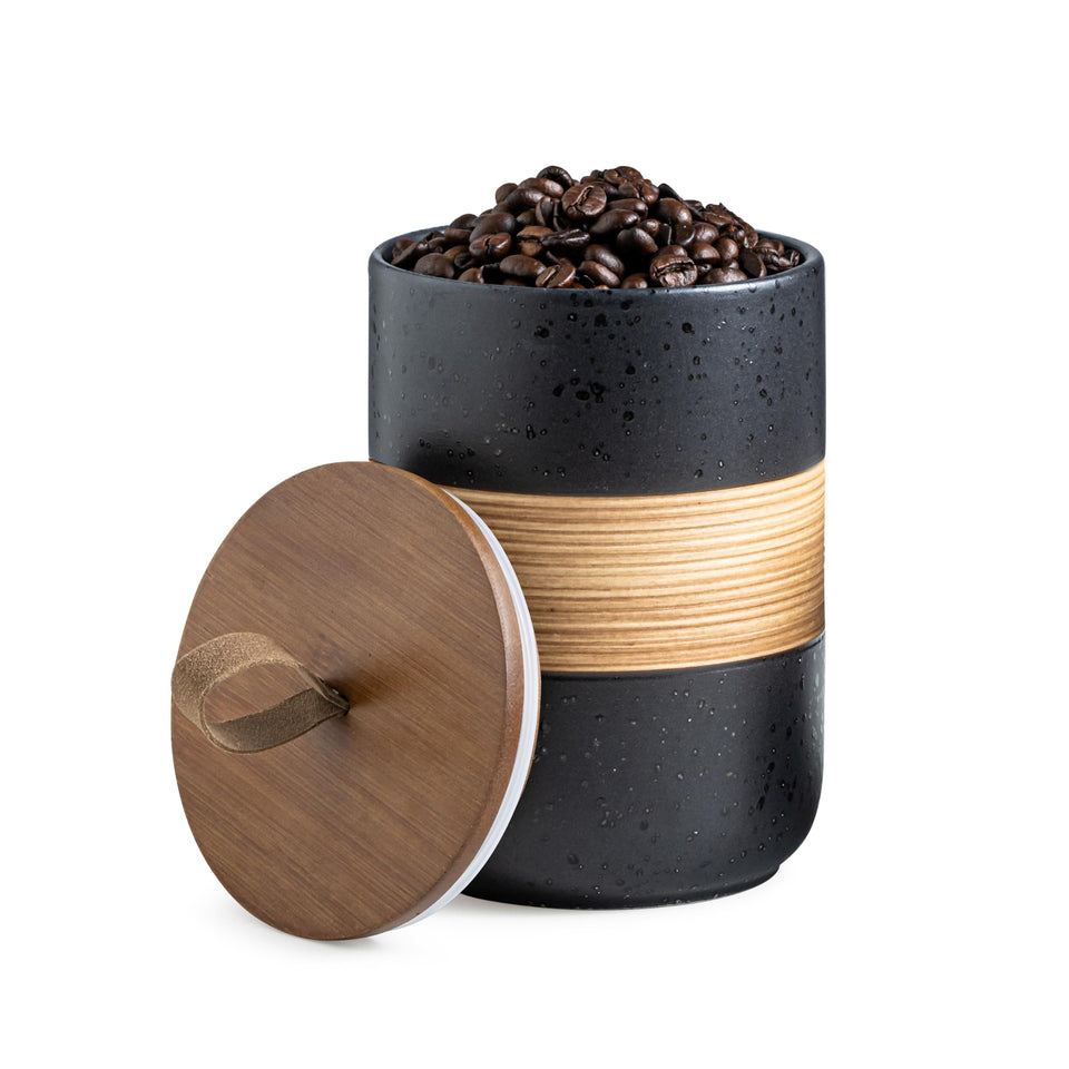Miamolo coffee container jar with lid in black keeps coffee fresh on the counter.
