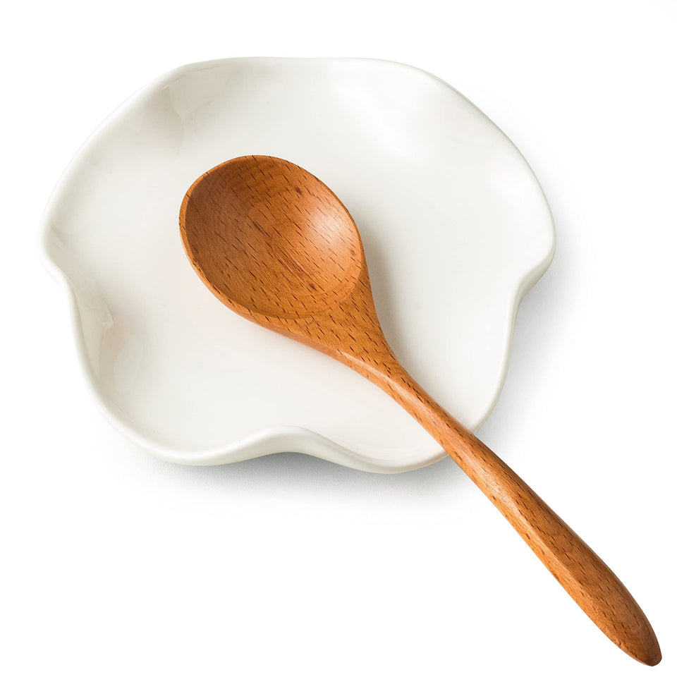 Miamolo spoon rest on stove top in white keeps countertops clean and organized.