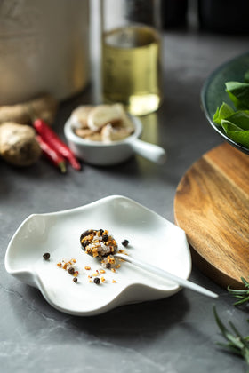 Miamolo spoon rest holds utensils and doubles as a small catch-all dish.