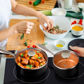 Michelangelo glass lid lets you monitor food while maintaining heat.