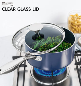 Michelangelo blue saucepan with lid ready for serving at table.