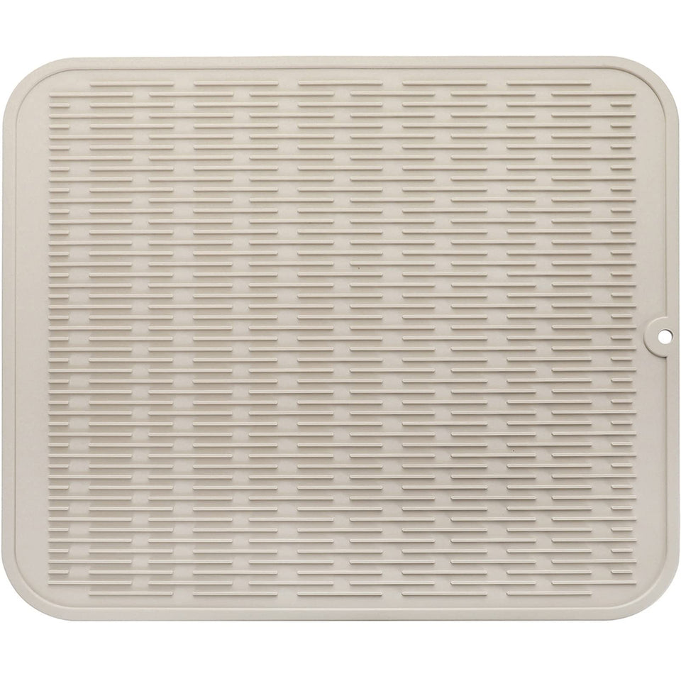 MicoYang silicone dish drying mat on counter drying dishes and protecting the surface.