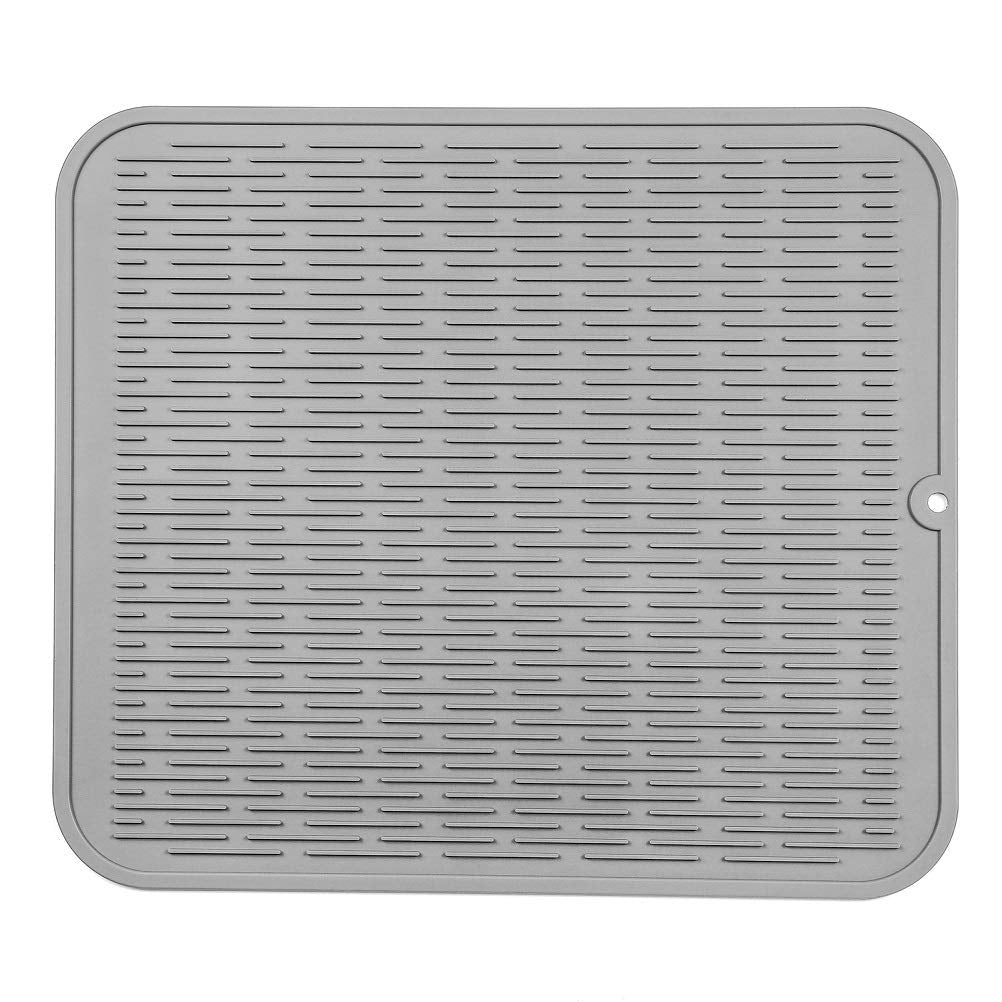 MicoYang silicone drying mat on counter dries dishes and protects surfaces.