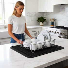 Foldable MicoYang drying mat stored compactly in a cabinet