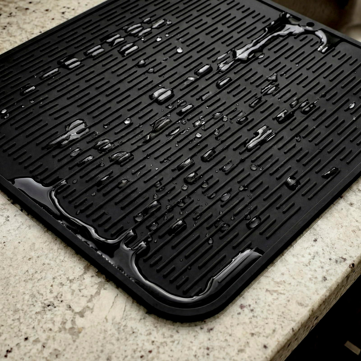 MicoYang silicone drying mat beside dishes for quick air drying.