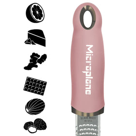 Microplane dusty rose zester blade closeup showing ultra sharp stainless steel blades.
