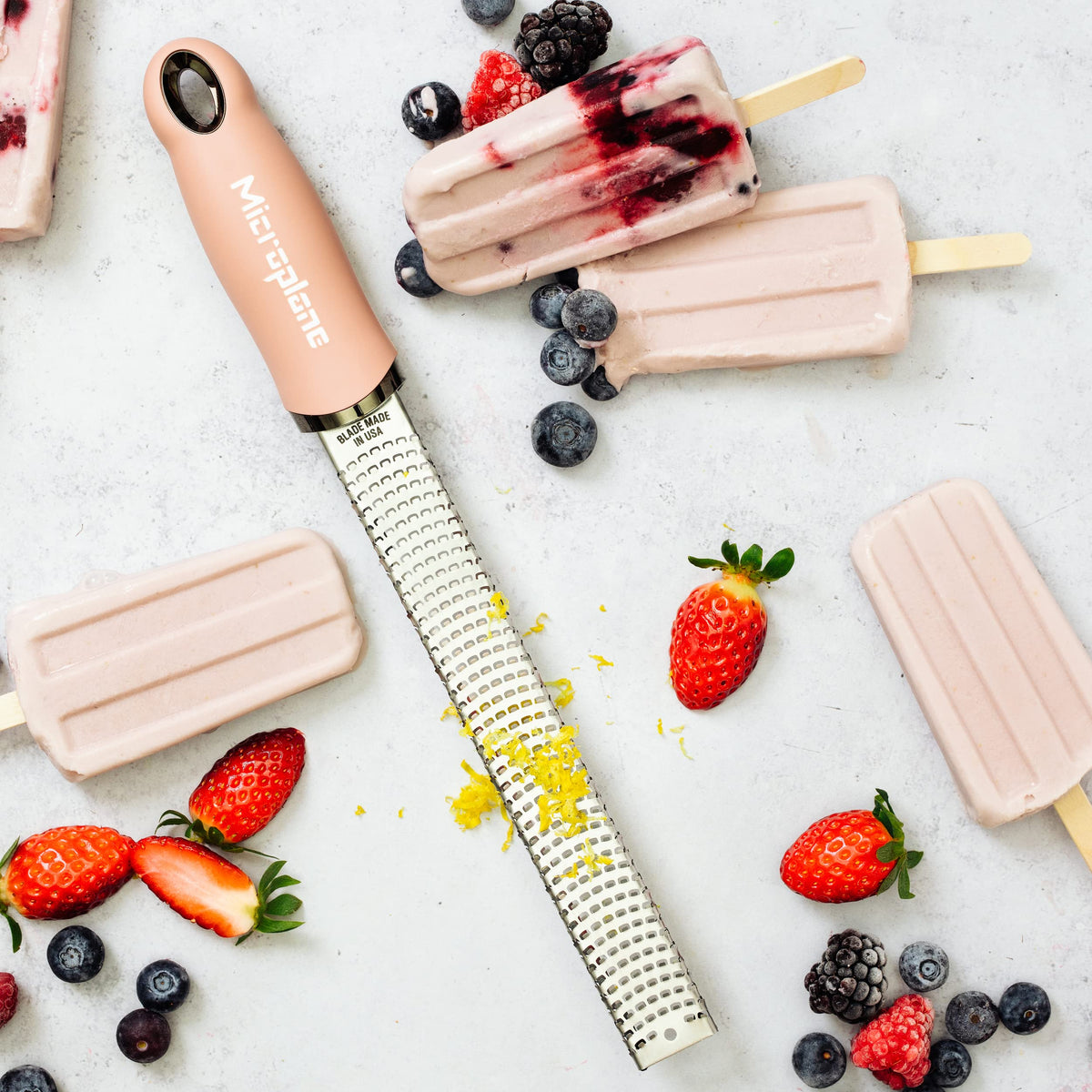 Microplane dusty rose zester cheese shavings ideal for topping dishes.