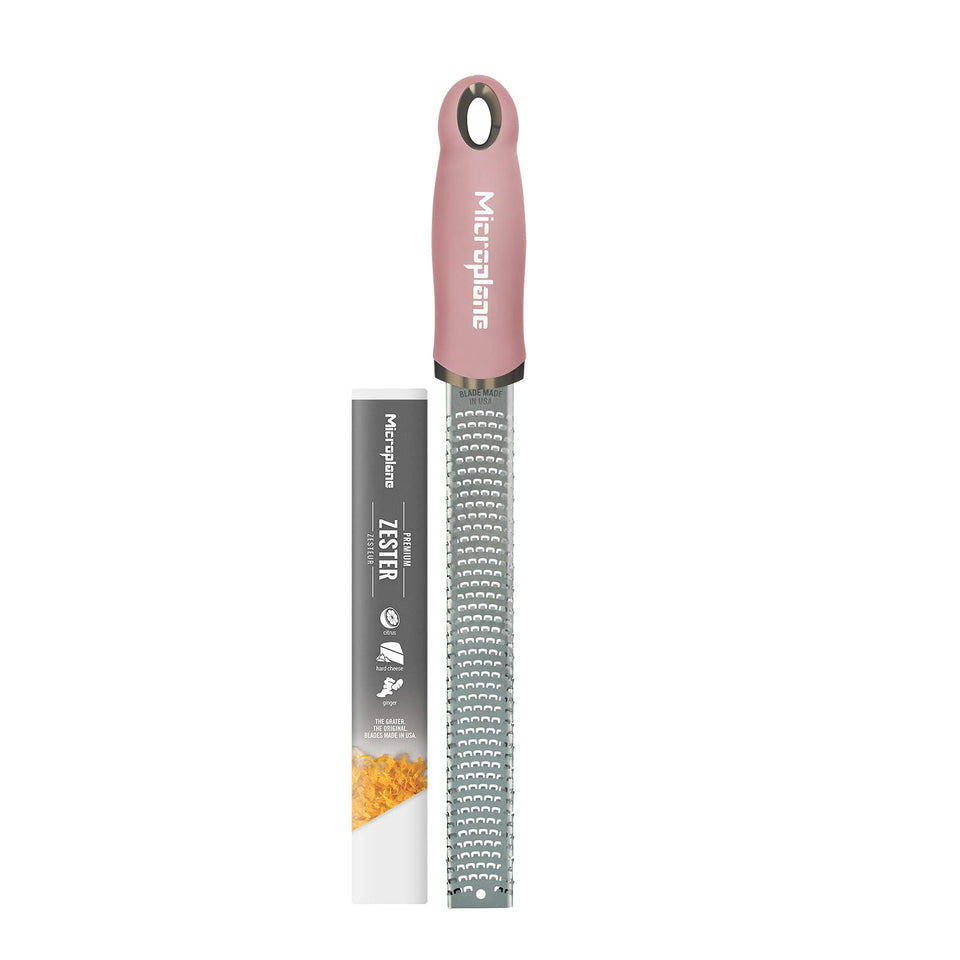 Microplane dusty rose zester citrus zest closeup for fresh, bright flavors.