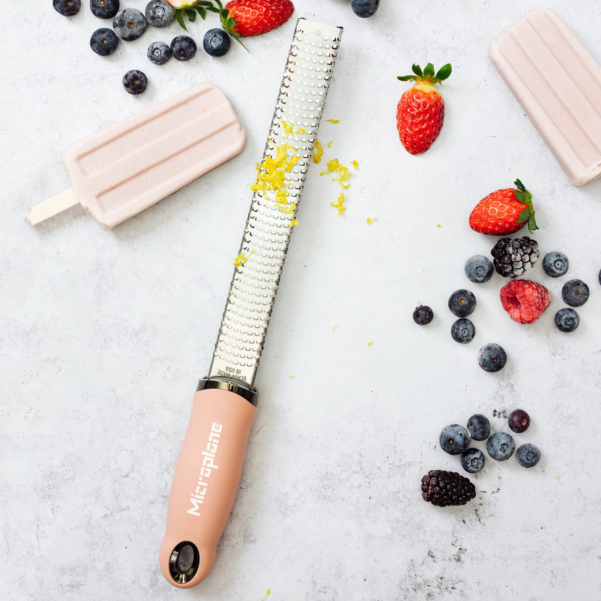Microplane dusty rose zester garlic mince for quick flavor boosts.