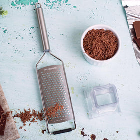Microplane ideal for grating ginger, coconut, nuts, and horseradish.