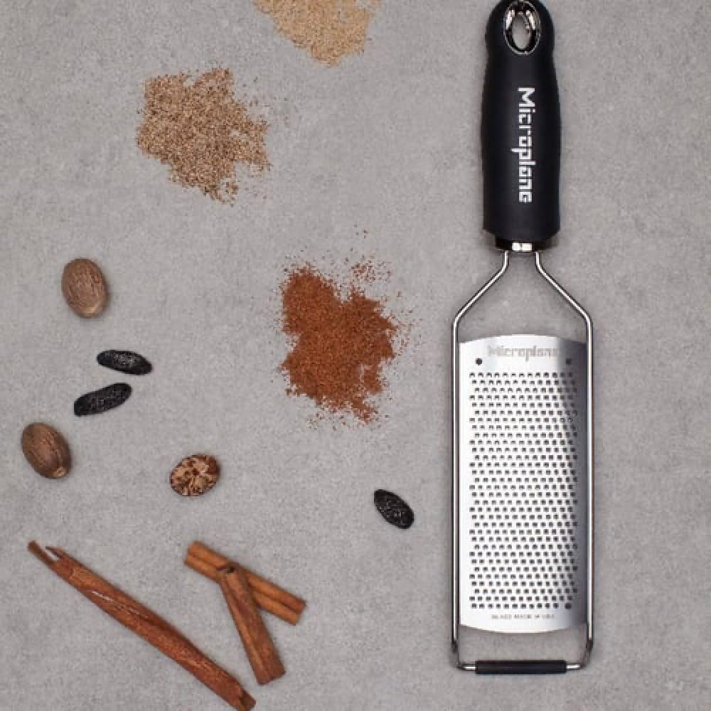 Microplane Gourmet Series grater close-up shows fine texture for Parmesan.