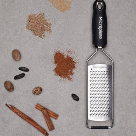 Microplane Gourmet Series grater close-up shows fine texture for Parmesan.