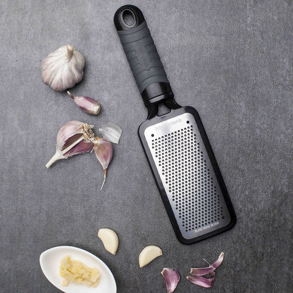 Microplane Home Series fine cheese grater features flat storage design for easy keeping.