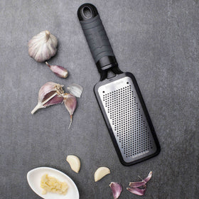Microplane Home Series fine cheese grater features flat storage design for easy keeping.