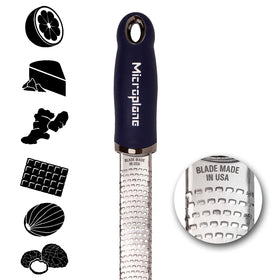 Microplane Premium Zester blade close-up showing ultra-sharp USA-made blades for precise zesting.