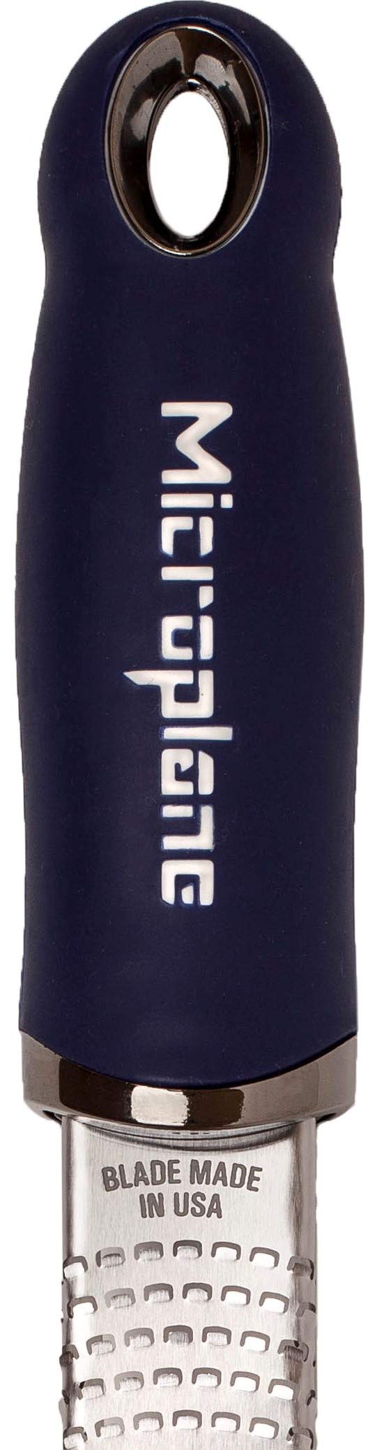 Microplane Premium Zester zesting lemon to brighten dressings and sauces.