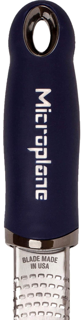 Microplane Premium Zester zesting lemon to brighten dressings and sauces.