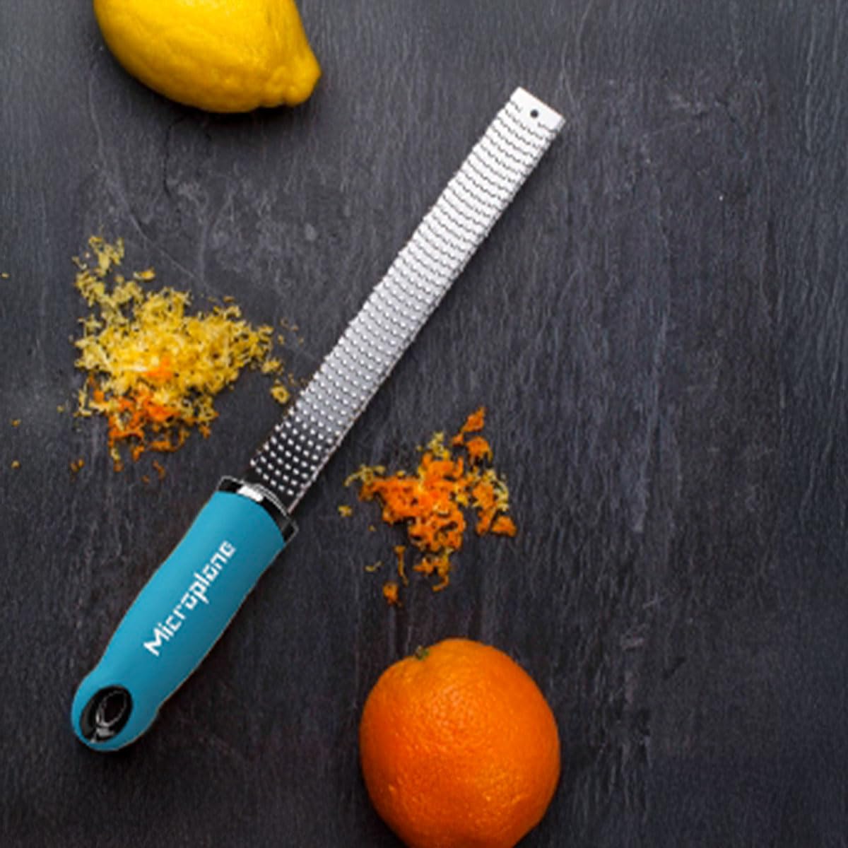 Microplane Premium Classic Turquoise zester zesting lemon to brighten vinaigrettes and desserts