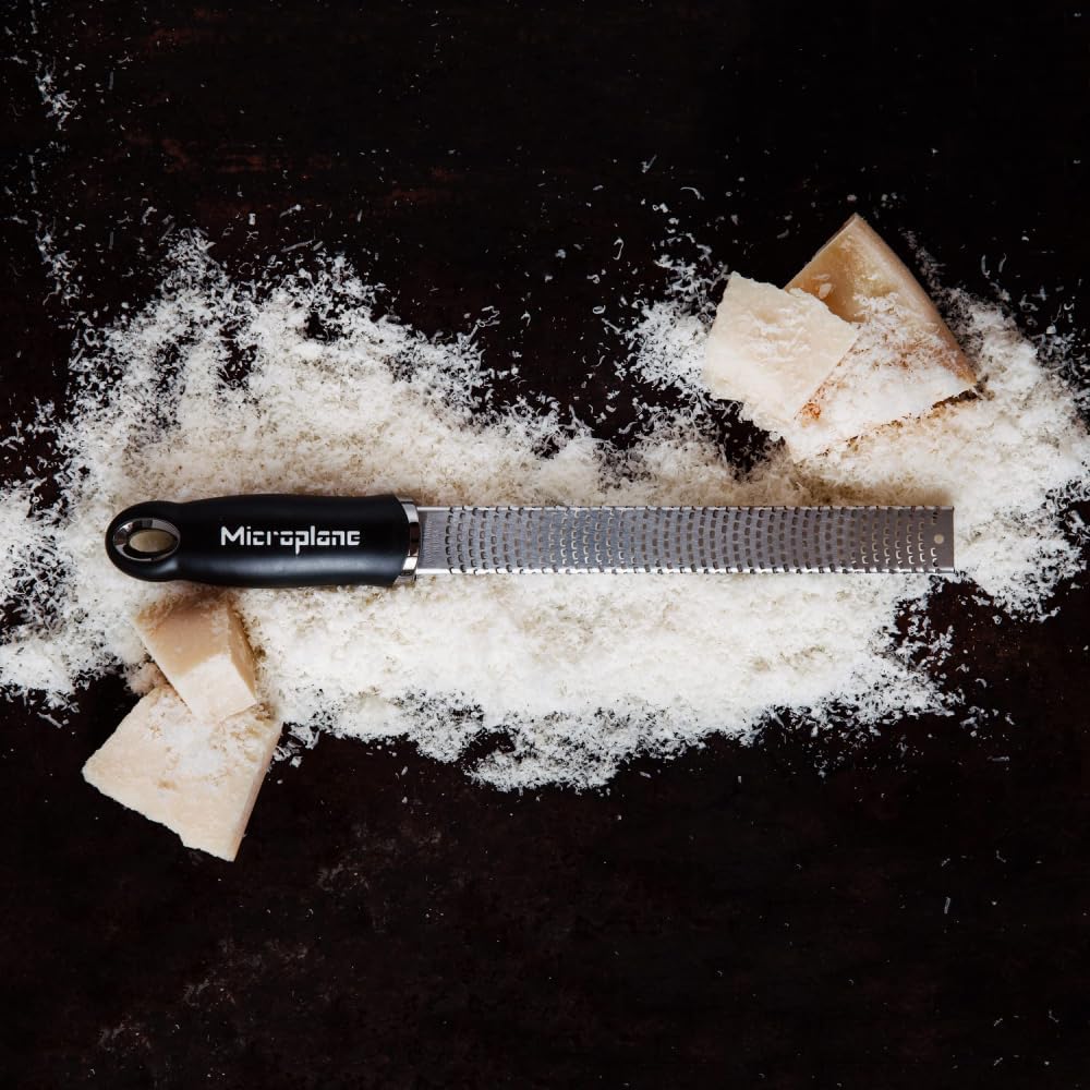 Ginger minced with Microplane Premium Classic Zester for smooth pastes.
