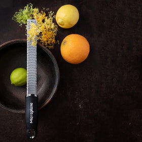 Nutmeg shaved into fine dust with Microplane Premium Classic Zester for baking.
