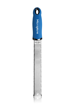 Microplane Premium Classic Zester with blue handle design enhances grip during zesting.