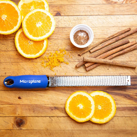 Microplane Premium Classic Zester showcases citrus zest in action for fresh flavor.
